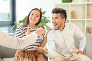 Happy couple accepting new house keys